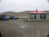 Tibet Kailash 11 Back 01 Paryang New Hotel On the way back, we stopped at a brand new comfortable clean guesthouse in Paryang (4590m), called the Parmarth Paryang Ashram (tourist rest house). The ashram was built by Pujya Swami Chidanand Saraswatiji of the India Heritage Research Foundation. The  Swamiji is also building a new guesthouse at Dirapuk and soon plans to build one at Zutulpuk. Life just got more comfortable - thank you very much.